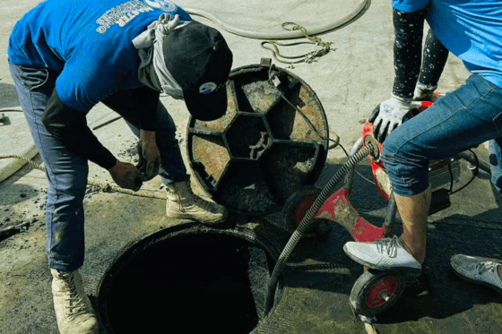 Sewer line hydro-jetting by a professional plumber, effectively removing a severe clog from a commercial property.